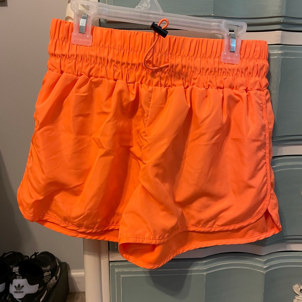 Orange high waisted Forever 21 shorts.